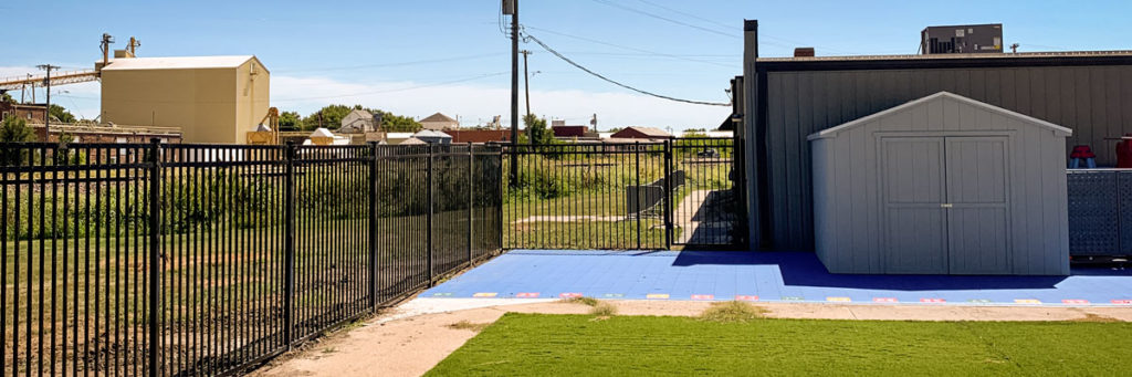 Black Closed Ornamental Picket Fence For A Commercial Property Near