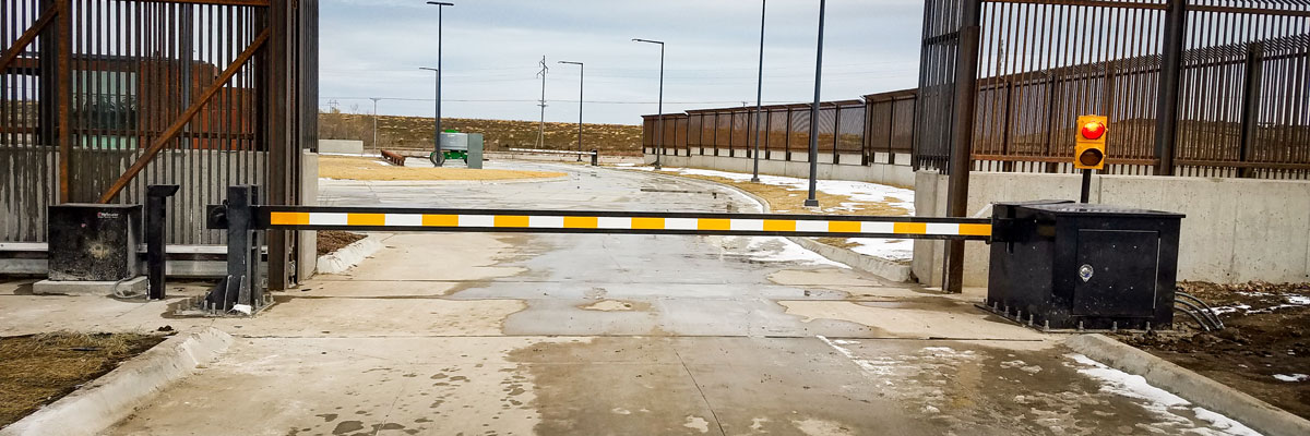 close-exterior-view-of-a-yellow-and-white-crash-rated-barrier-arm-with