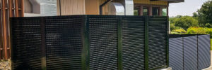 Omaha fence company commercial fencing contractors Omaha, Nebraska architectural mechanical screening screen louvered semi private private solid staggered board on board shadow box alternating industrial louvers rooftop louvers chillers generators truck wells outside storage condensors rooftop equipment patios trash dumpsters transformers HVAC courtyards pool equipment fence aluminum galvanized steel degree of openness direct visibility standalone wall louvers